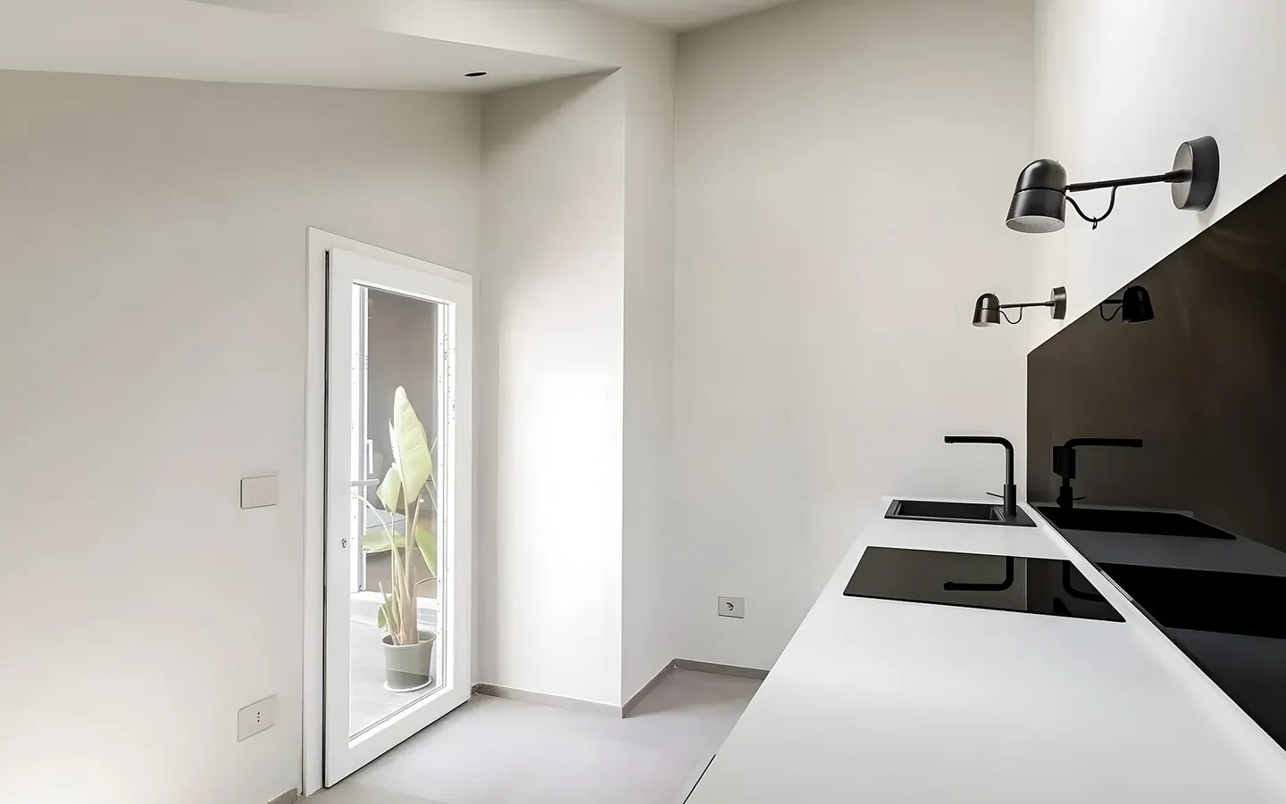 Cocina abierta al salón con isla de madera en una reforma integral en Sant Miquel, Granollers